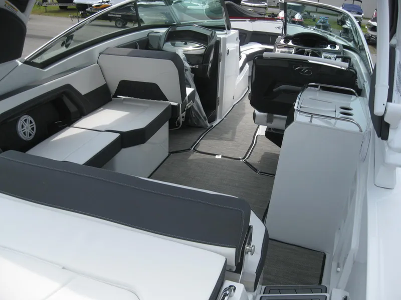 Slide: The Image of 2024 Monterey 305 SS boat interior with modern seating and sleek design. - 7