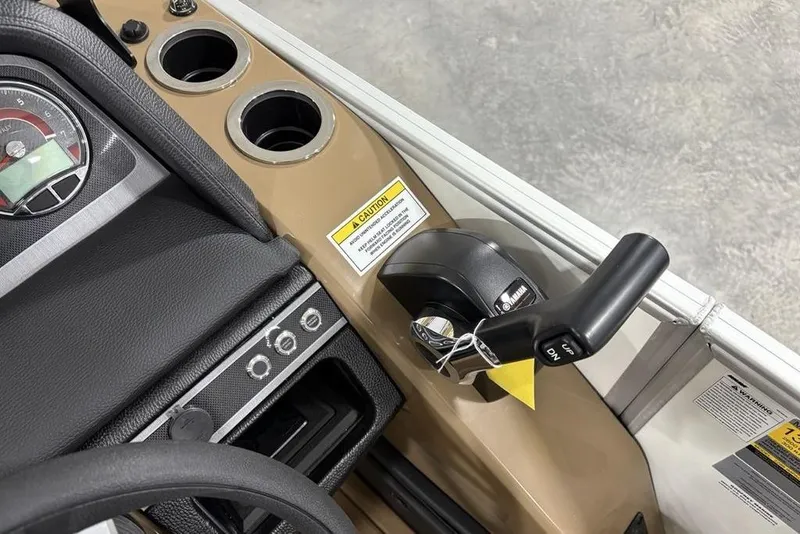 Slide: The Image of Control panel of 2026 Godfrey Monaco 235 SFL boat with throttle lever and gauges. - 11