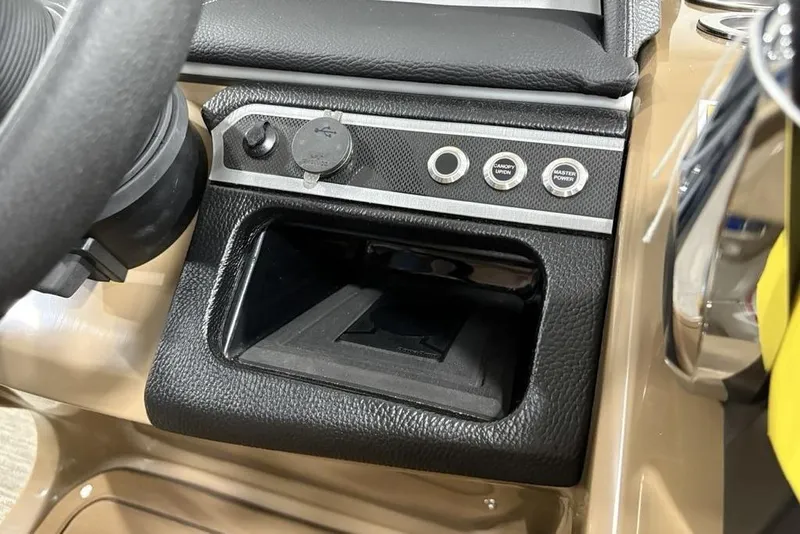 Slide: The Image of 2026 Godfrey Monaco 235 SFL dashboard with USB port and control buttons. - 13