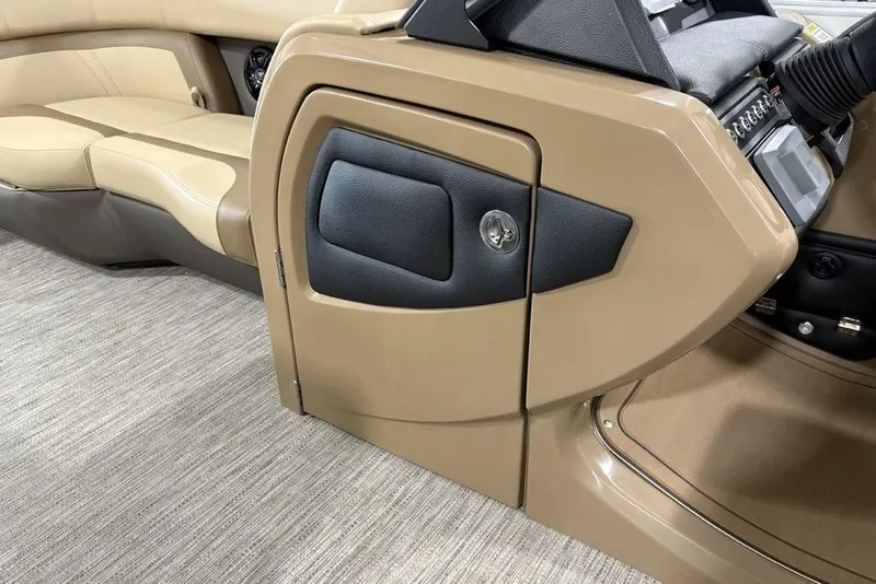 Slide: The Image of Interior of 2026 Godfrey Monaco 235 SFL boat, featuring beige seating and control panel. - 14