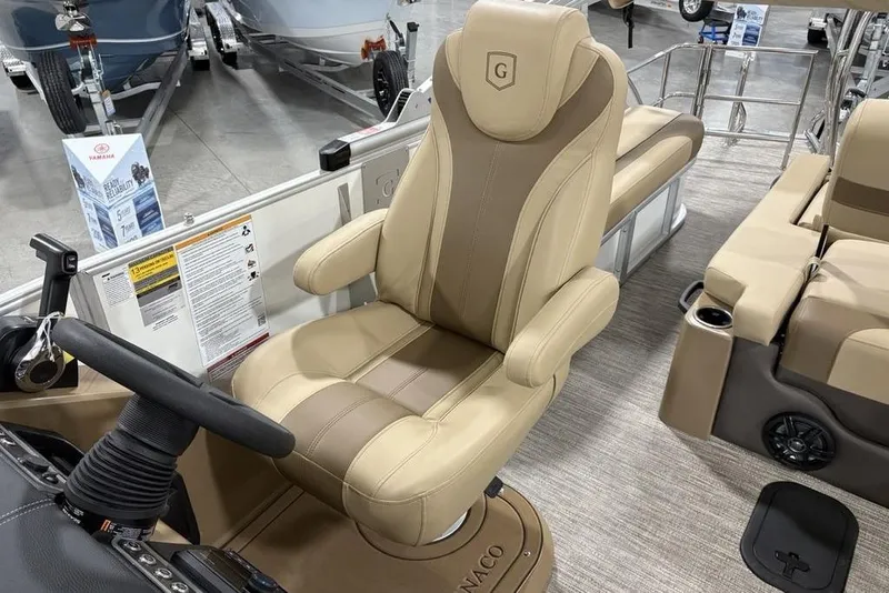 Slide: The Image of Captain's chair in 2026 Godfrey Monaco 235 SFL pontoon boat, showcasing luxury design. - 18