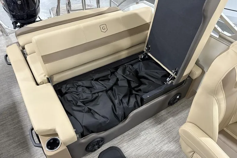 Slide: The Image of 2026 Godfrey Monaco 235 SFL boat seat with storage compartment open. - 25