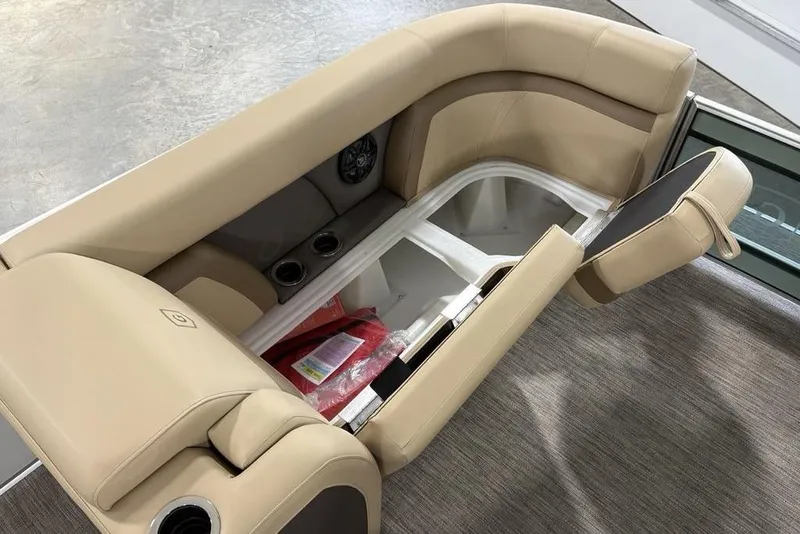 Slide: The Image of 2026 Godfrey Monaco 235 SFL boat seat with storage compartment open, beige upholstery. - 5