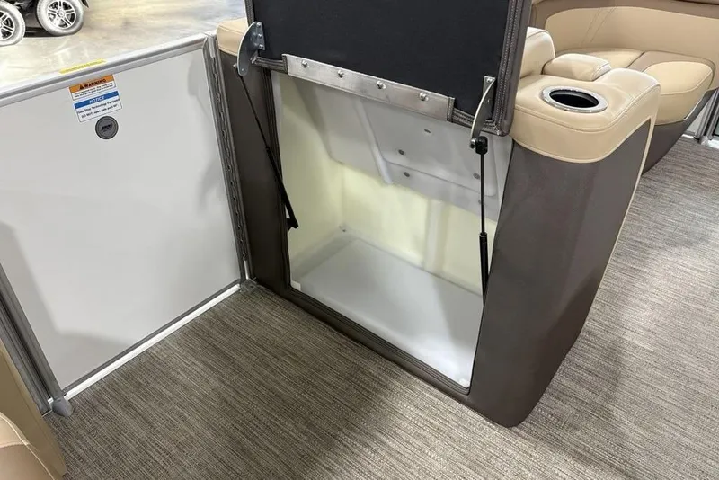 Slide: The Image of Interior of 2026 Godfrey Monaco 235 SFL boat, featuring seating and storage area. - 7