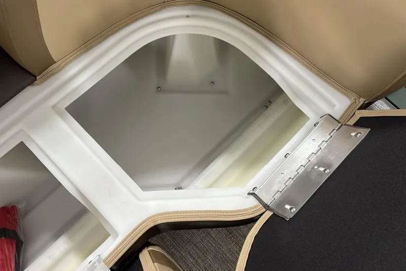 Slide: The Image of Open storage compartment in 2026 Godfrey Monaco 235 SFL boat, featuring beige seating. - 9