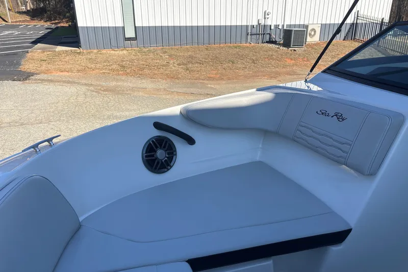 Slide: The Image of 2023 Searay SPX 210 OB boat interior with white seating and speaker. - 14