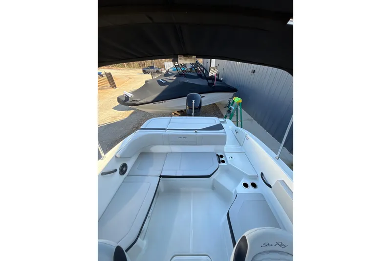 Slide: The Image of 2023 Searay SPX 210 OB boat interior with seating and cup holders. - 21