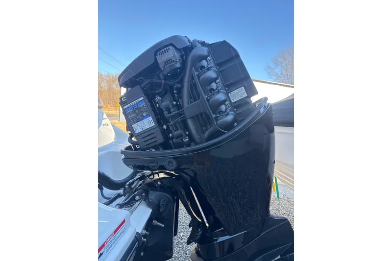 Slide: The Image of 2023 Searay SPX 210 OB outboard motor, detailed view, sunny day. - 26