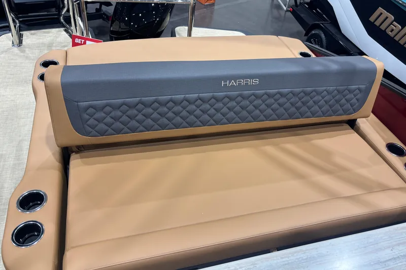 Slide: The Image of 2026 Harris Sunliner 230 boat seat with quilted backrest and integrated cup holders. - 12