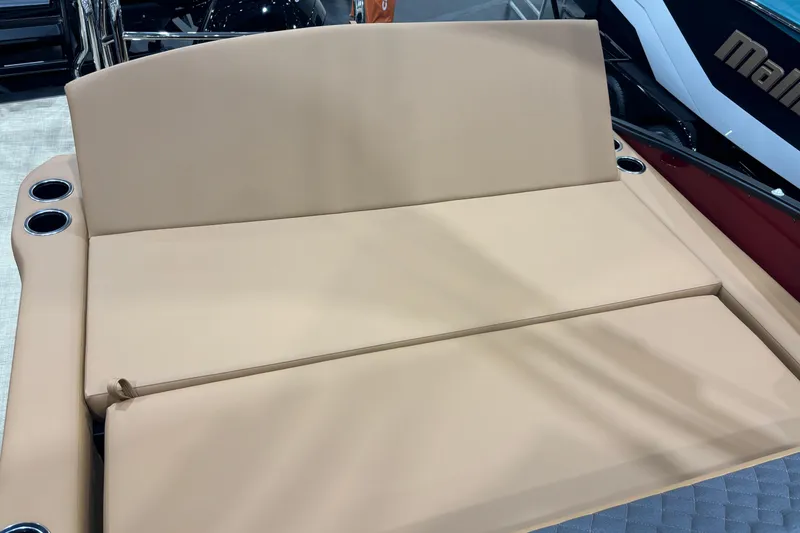 Slide: The Image of 2026 Harris Sunliner 230 boat with beige seating and cup holders. - 14