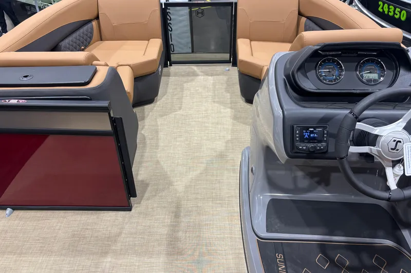 Slide: The Image of 2026 Harris Sunliner 230 interior with tan seating and modern dashboard controls. - 6