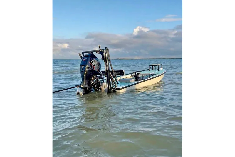 Slide: The Image of Steering console of a 2017 Dusky 16 Custom boat with modern navigation equipment. - 3