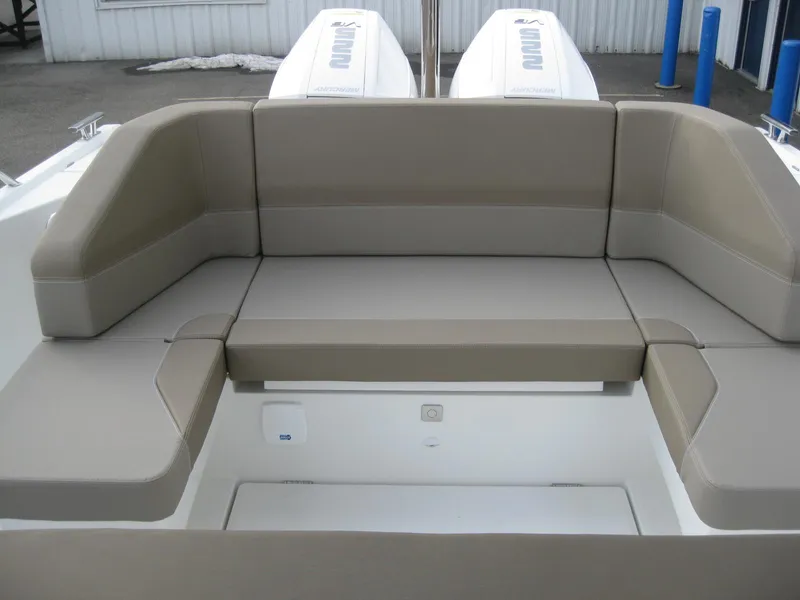 Slide: The Image of 2024 Nimbus T9 boat with spacious beige seating area. - 21