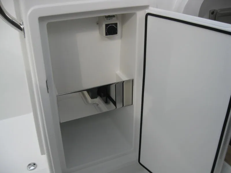 Slide: The Image of Open storage compartment in 2024 Nimbus T9 boat. - 27