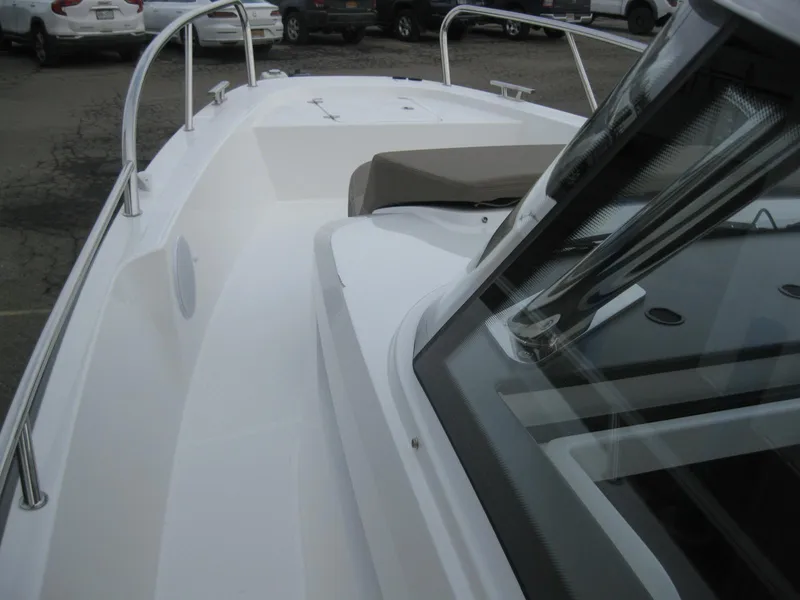 Slide: The Image of 2024 Nimbus T9 boat deck with windshield and seating area. - 37