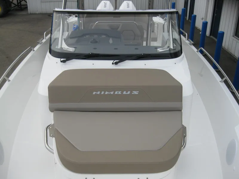 Slide: The Image of 2024 Nimbus T9 boat with windshield and cushioned seating. - 39