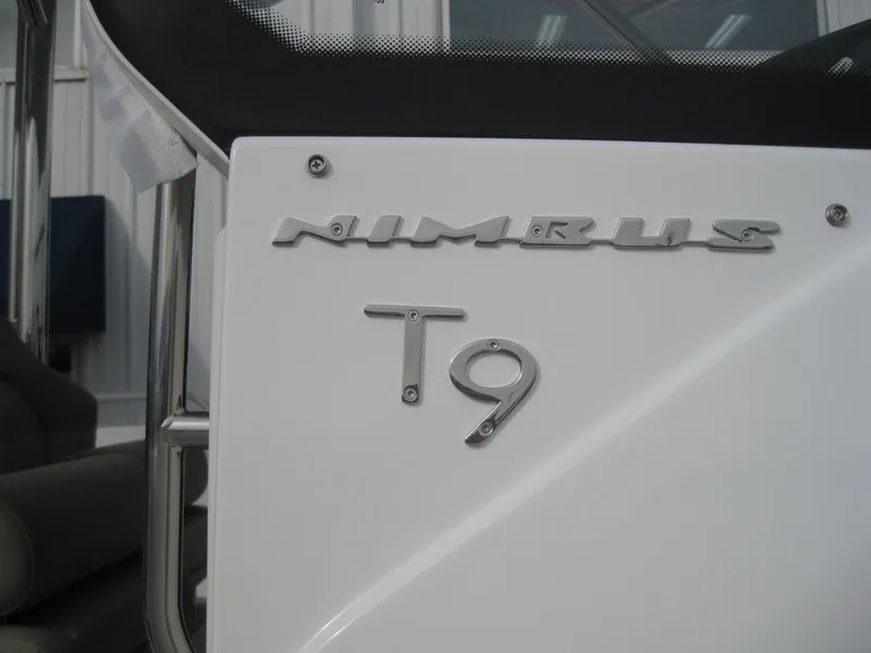 Slide: The Image of 2024 Nimbus T9 boat model nameplate in silver on white background. - 6