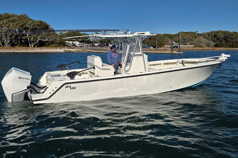 Slide: The Image of 2017 SeaVee 320B boat on water, featuring a powerful outboard engine. - 5