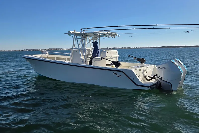 Slide: The Image of 2017 SeaVee 320B boat on water, featuring dual outboard engines. - 6