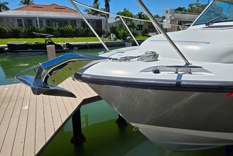 Slide: The Image of 2016 Boston Whaler 315 Conquest boat anchored at a dock, sunny day. - 4