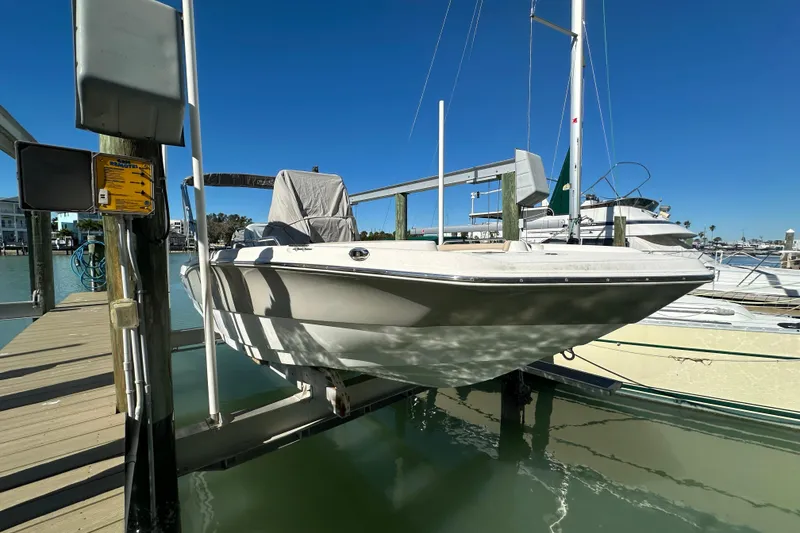 The Image of 2017 NauticStar 211 Angler boat docked at marina under clear blue sky. - 0