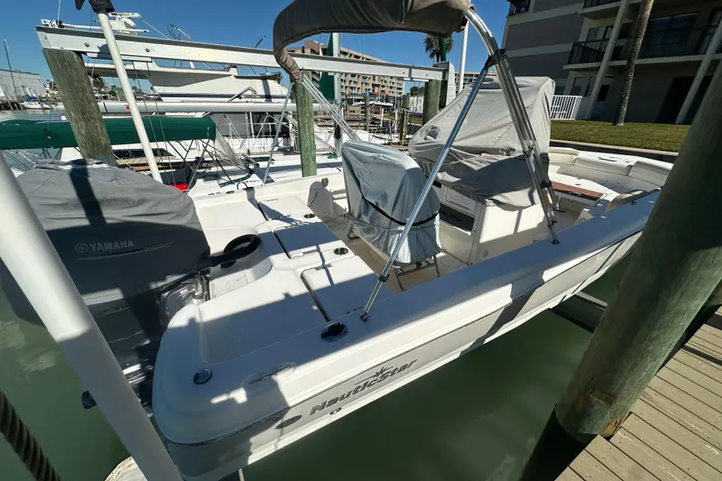 Slide: The Image of 2017 NauticStar 211 Angler boat docked with Yamaha engine cover. - 5