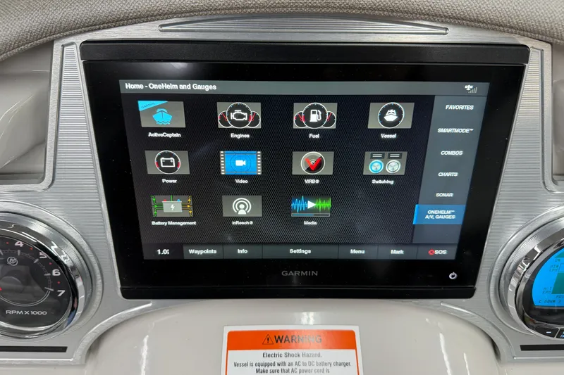 Slide: The Image of Garmin display on 2022 Crest Continental 250 SLS boat dashboard showing various controls and gauges. - 13