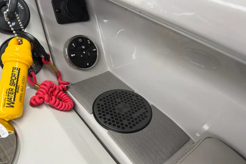 Slide: The Image of 2022 Crest Continental 250 SLS boat dashboard with controls and safety gear. - 18