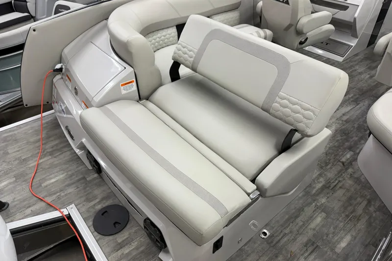 Slide: The Image of 2022 Crest Continental 250 SLS boat interior with luxurious seating and modern design. - 26