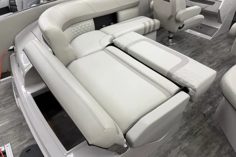 Slide: The Image of 2022 Crest Continental 250 SLS boat interior with luxurious white seating and modern design. - 28