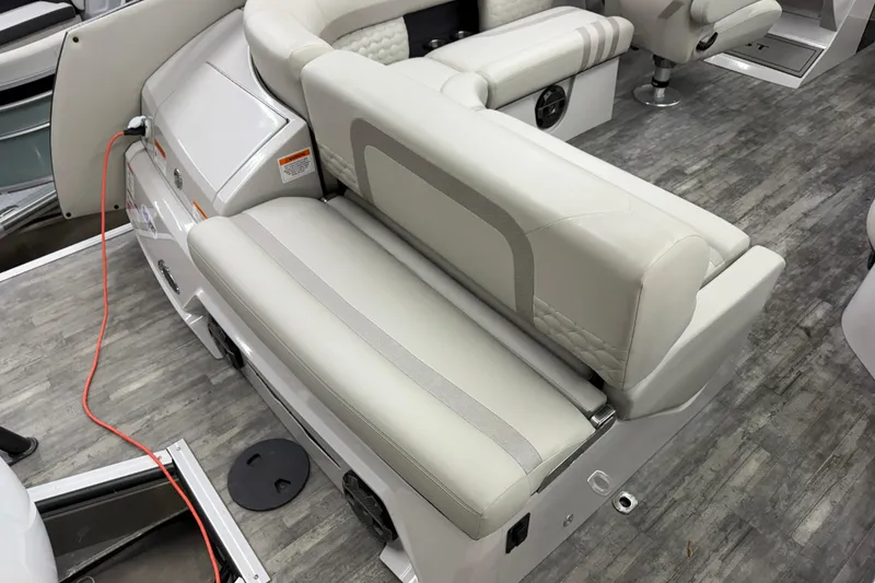 Slide: The Image of 2022 Crest Continental 250 SLS boat interior with luxurious seating and modern design. - 29