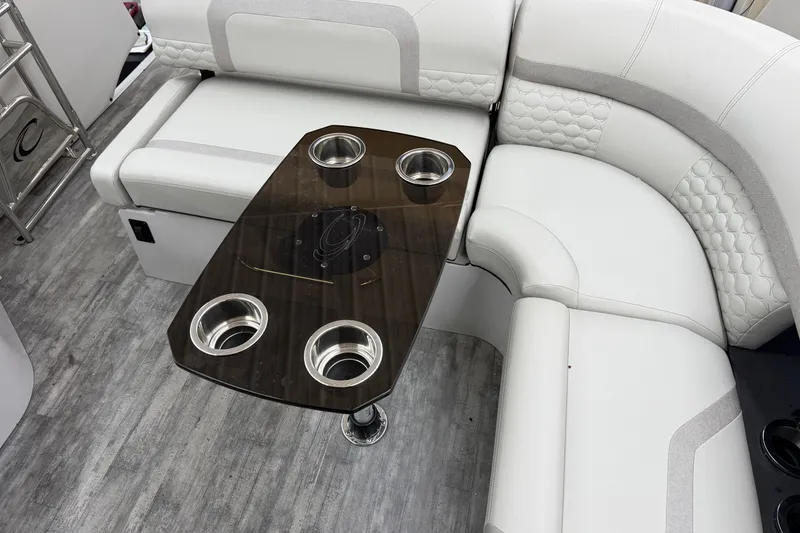 Slide: The Image of Luxurious seating area in 2022 Crest Continental 250 SLS with elegant table and cup holders. - 32