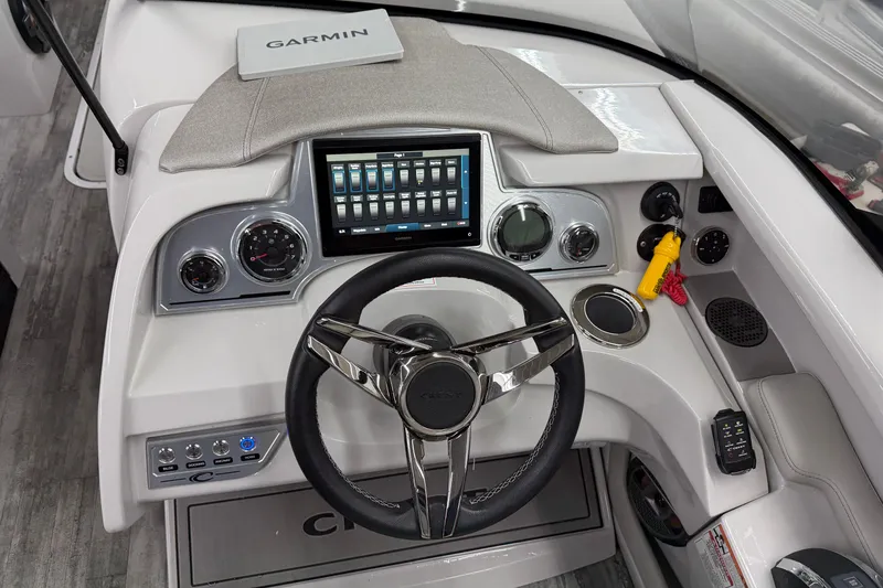 Slide: The Image of 2022 Crest Continental 250 SLS boat dashboard with Garmin navigation system and modern controls. - 9