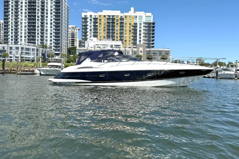 The Image of 2002 Sunseeker Camargue 44 yacht in urban marina setting. - 0