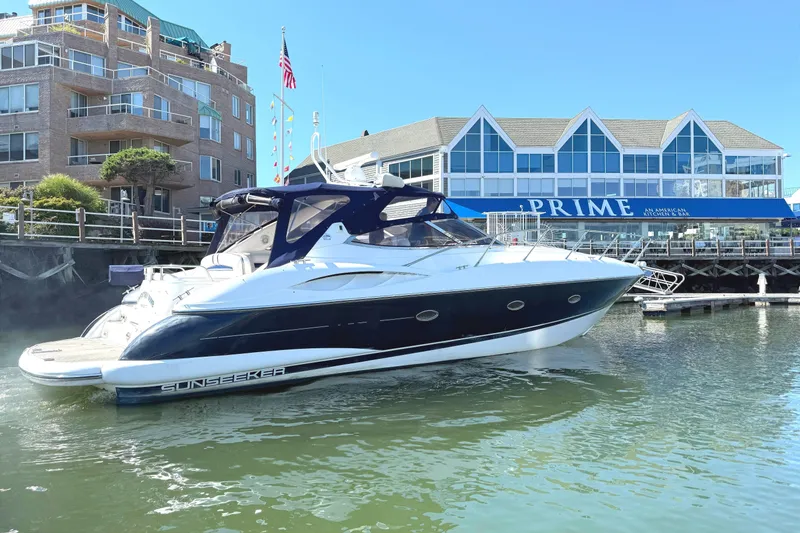 Slide: The Image of 2002 Sunseeker Camargue 44 yacht docked near a restaurant. - 1