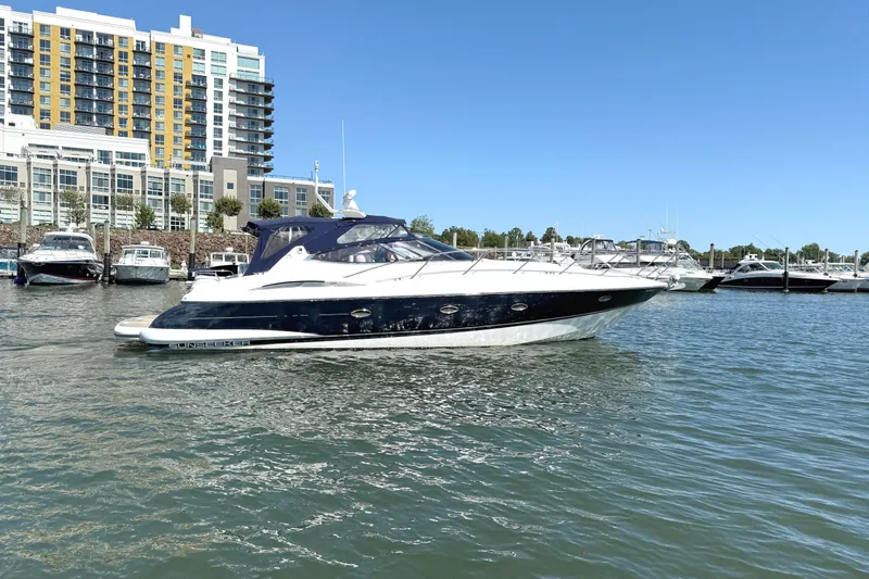 Slide: The Image of 2002 Sunseeker Camargue 44 yacht docked in marina. - 2