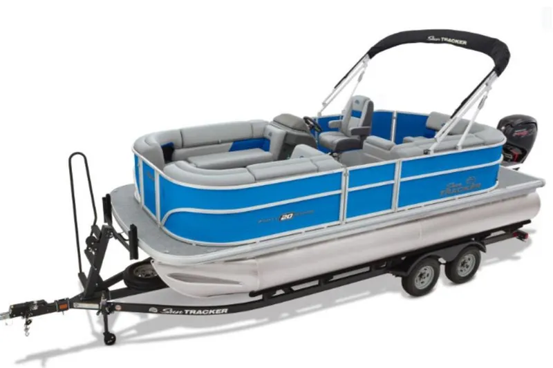 The Image of 2026 Sun Tracker Party Barge 20 DLX pontoon boat on trailer, blue and gray design. - 1