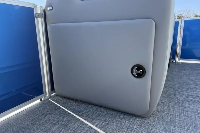 Slide: The Image of 2026 Sun Tracker Party Barge 20 DLX interior with gray panel and blue accents. - 15