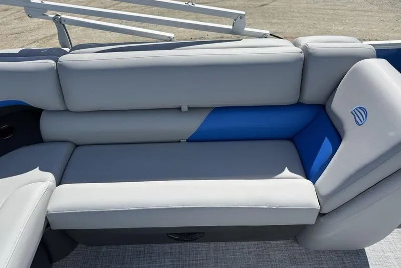 Slide: The Image of 2026 Sun Tracker Party Barge 20 DLX, gray and blue seating detail. - 18
