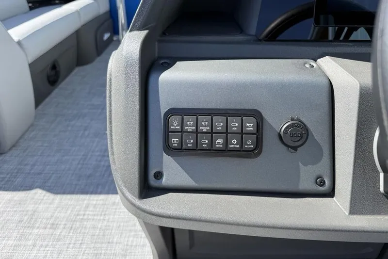 Slide: The Image of Control panel of 2026 Sun Tracker Party Barge 20 DLX with USB port and buttons. - 22