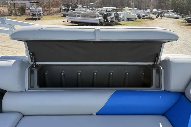Slide: The Image of Open storage compartment on 2026 Sun Tracker Party Barge 20 DLX pontoon boat. - 23