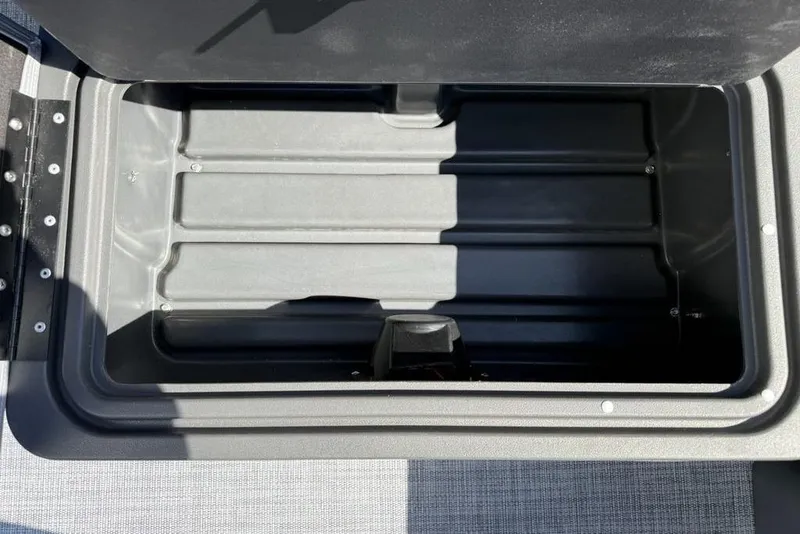 Slide: The Image of Open storage compartment in 2026 Sun Tracker Party Barge 20 DLX pontoon boat. - 25