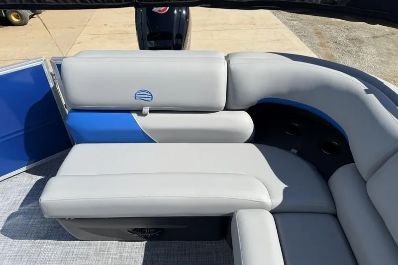 Slide: The Image of 2026 Sun Tracker Party Barge 20 DLX interior with gray and blue seating. - 27