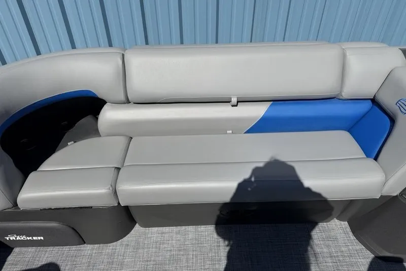 Slide: The Image of 2026 Sun Tracker Party Barge 20 DLX seating with gray and blue upholstery. - 4