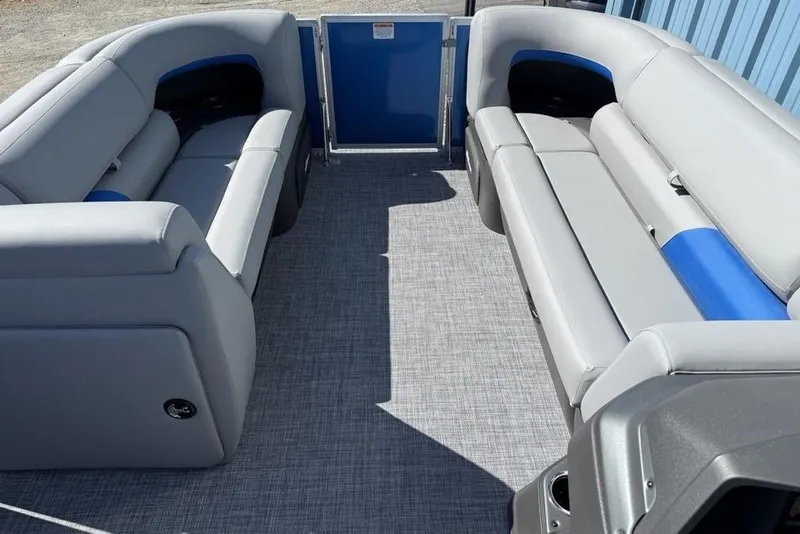 Slide: The Image of 2026 Sun Tracker Party Barge 20 DLX interior with gray and blue seating. - 5