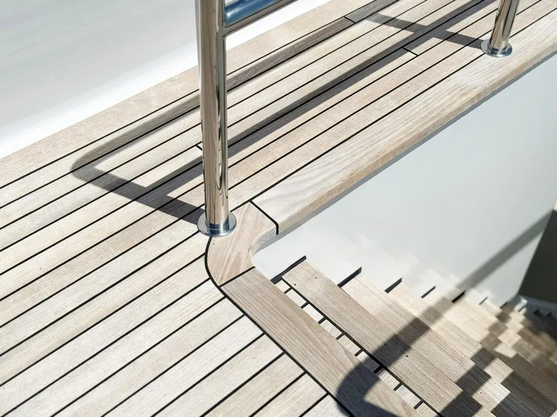 Slide: The Image of Teak deck and stainless steel railing on 1996 Cheoy Lee 145 Global Series yacht. - 12