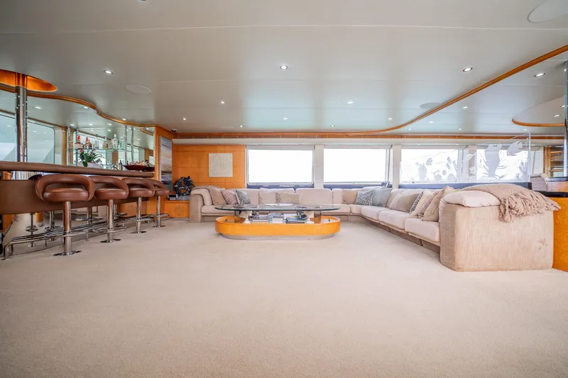 Slide: The Image of Luxurious interior of 1996 Cheoy Lee 145 Global Series yacht with spacious seating and bar area. - 35