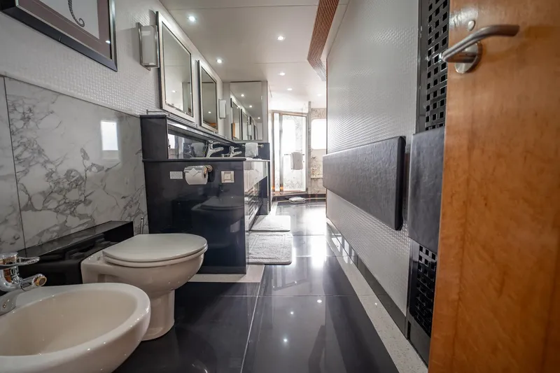 Slide: The Image of Luxurious bathroom on 1996 Cheoy Lee 145 Global Series yacht, featuring modern fixtures and elegant design. - 49