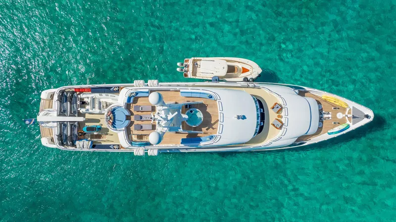Slide: The Image of Aerial view of 1996 Cheoy Lee 145 Global Series yacht on turquoise water. - 5