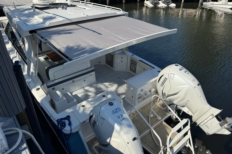 Slide: The Image of 2021 World Cat 400 DC-X boat with Yamaha engines docked at marina. - 14